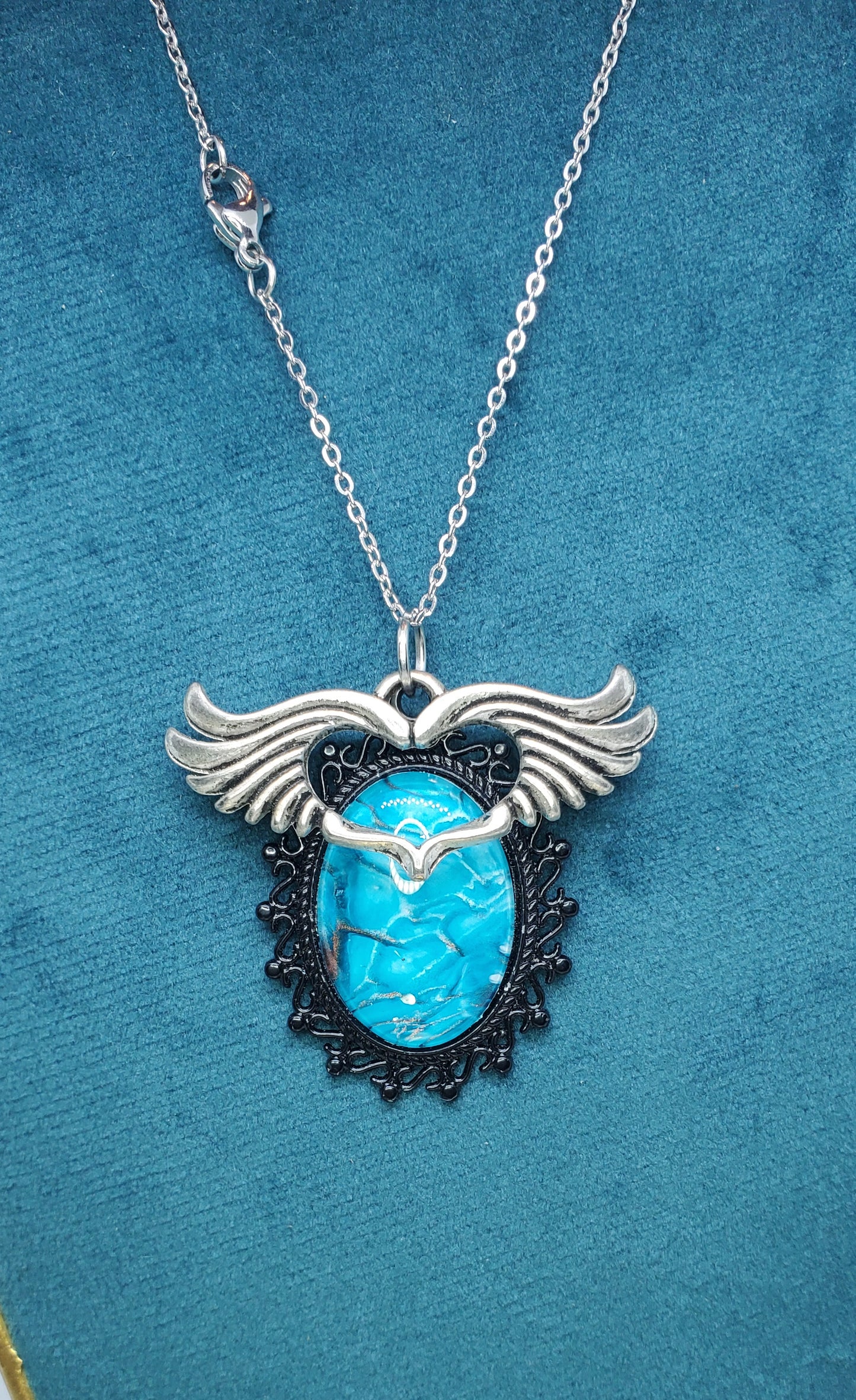 Brilliant Blue Fluid Art Necklace with Silver Wings