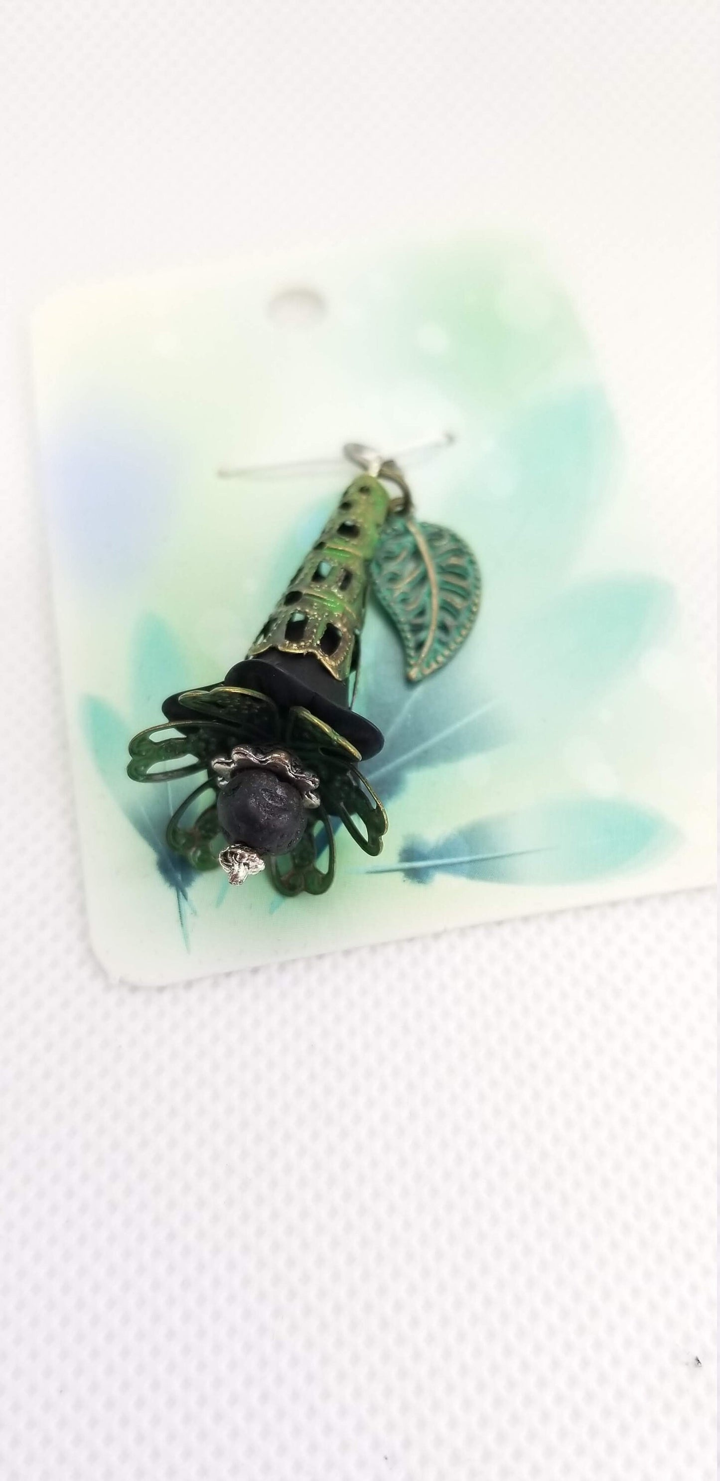 Black and Green Patina Flower and Lava Bead Pendant